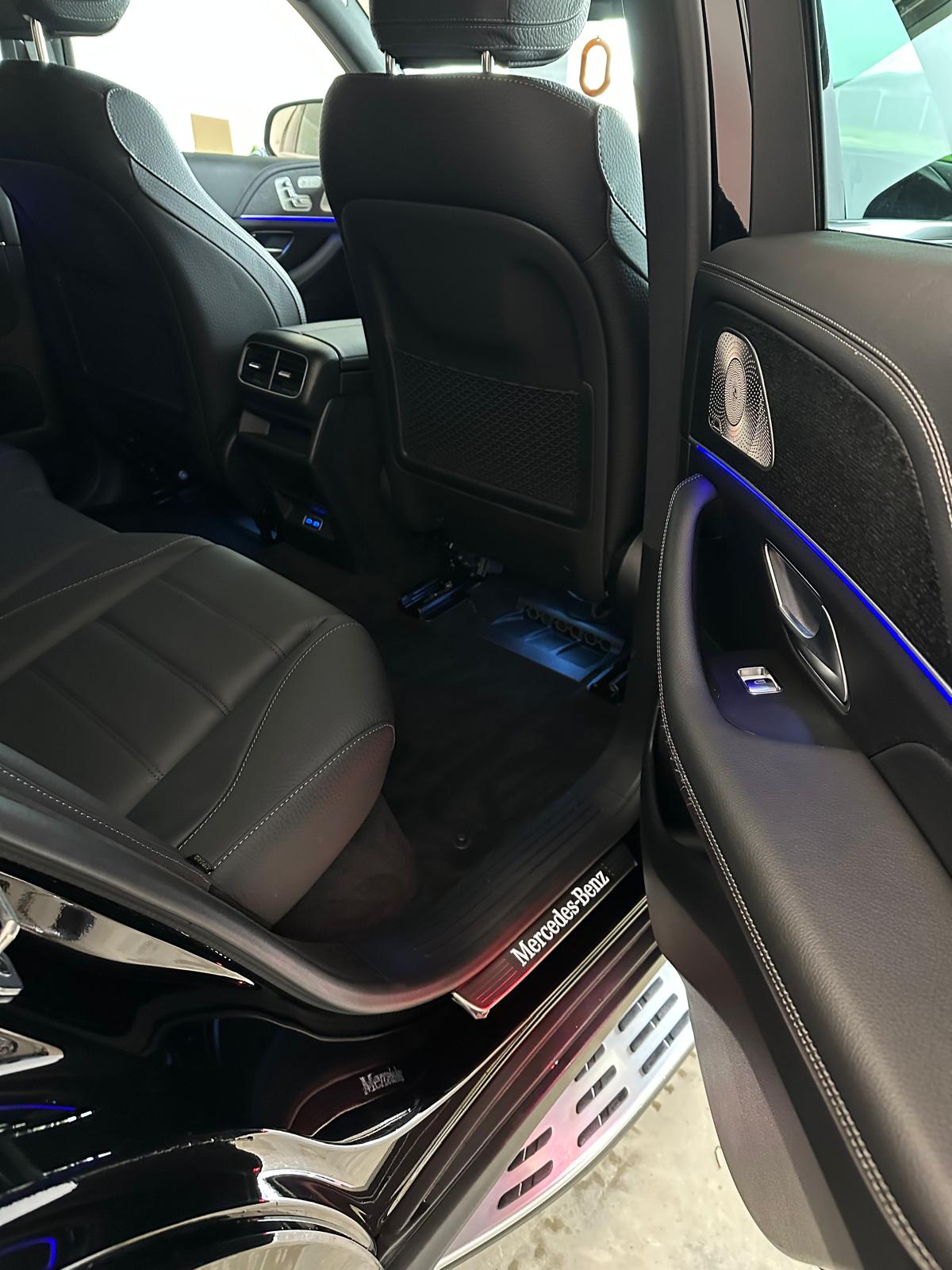 Cleaned leather rear seats, door trim and sill of a Mercedes SUV